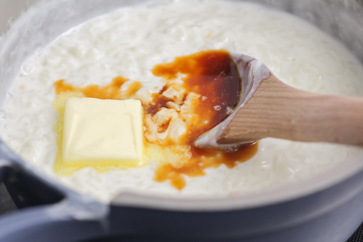 Adding vanilla and butter to rice pudding.