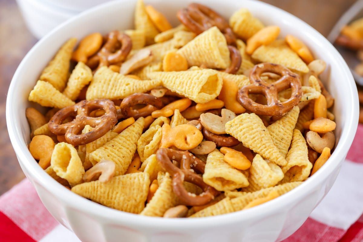 A white bowl filled with snack mix.