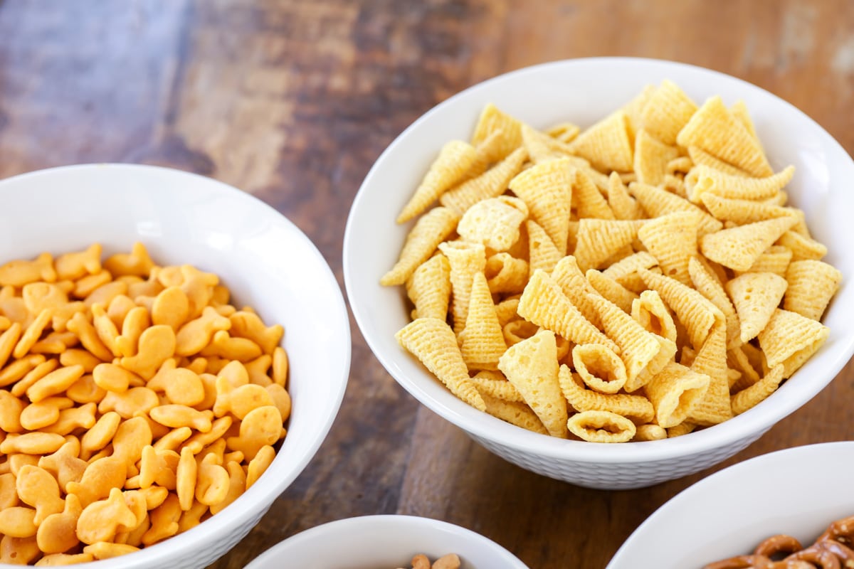 Close up of bowl of Bugles and goldfish on a kitchen table.