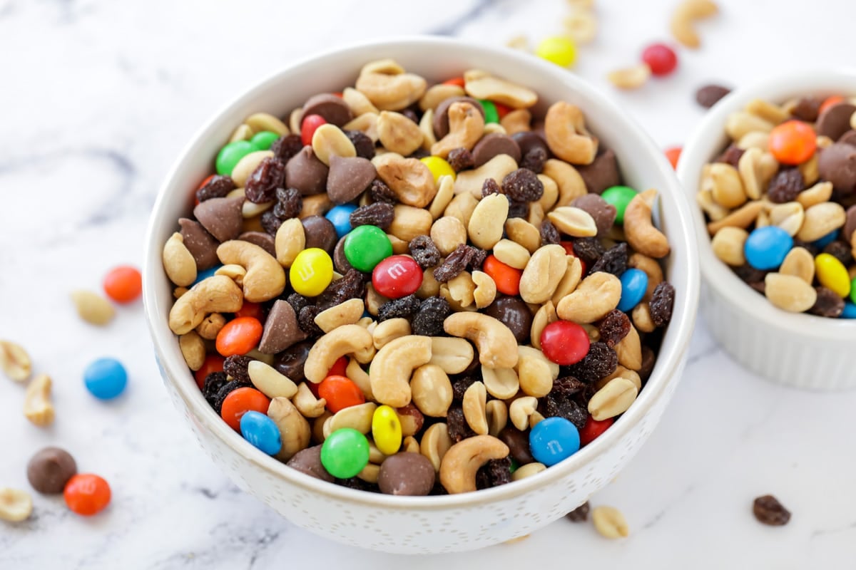 A white bowl filled with trail mix recipe.
