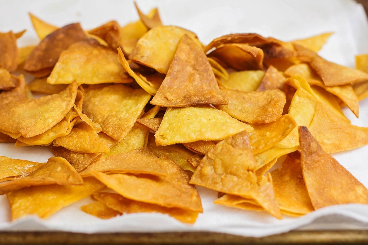 A pile of fried tortilla chips for making chilaquiles recipes.