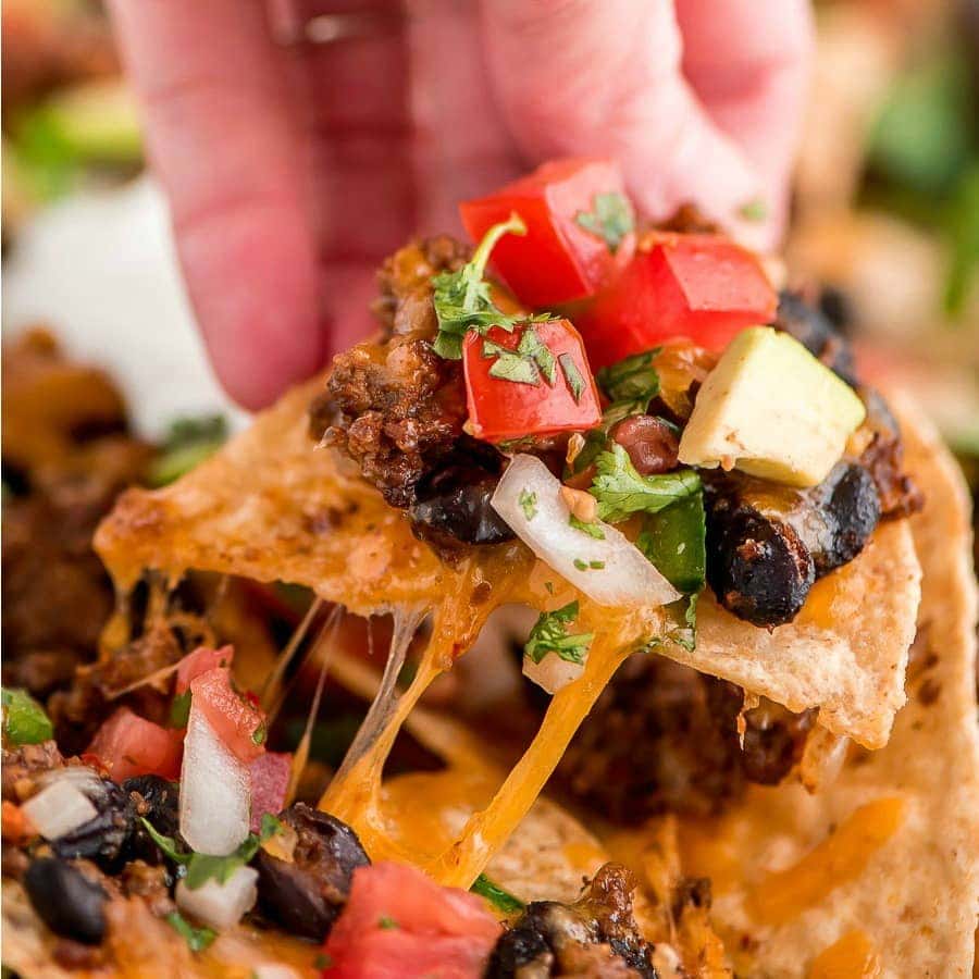 Loaded Nachos topped with cheese and pico de gallo.