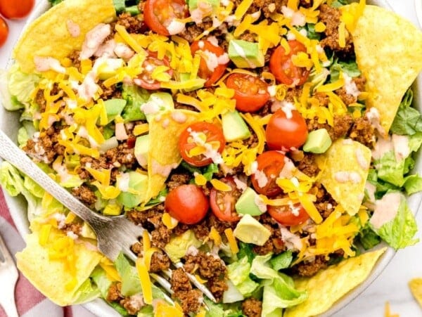 Homemade Taco Salad Dressing recipe on taco salad in bowl.