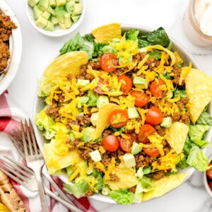 A bowl of taco salad recipe with a homemade dressing.
