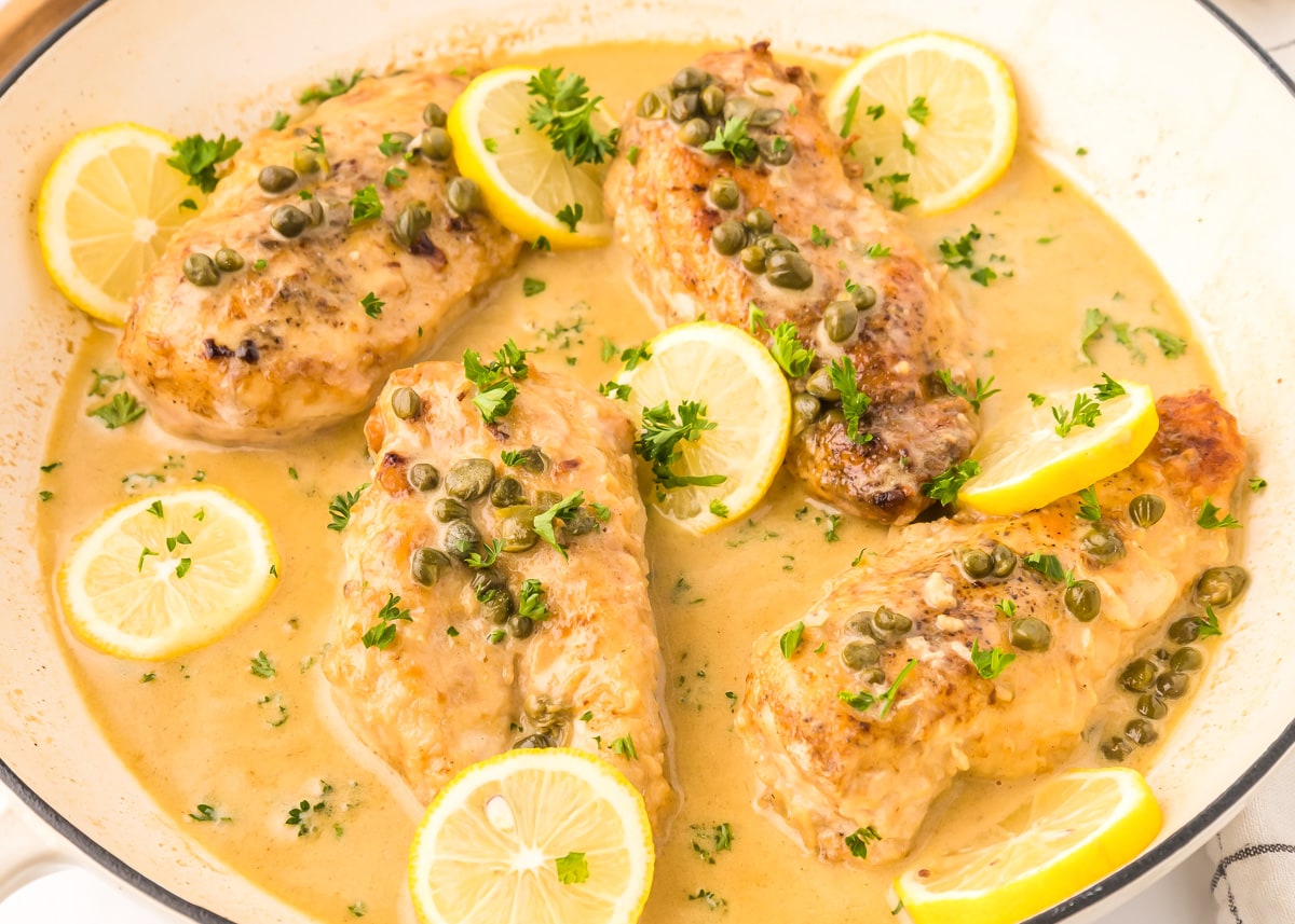 Best chicken piccata recipe topped with lemon slices and capers.