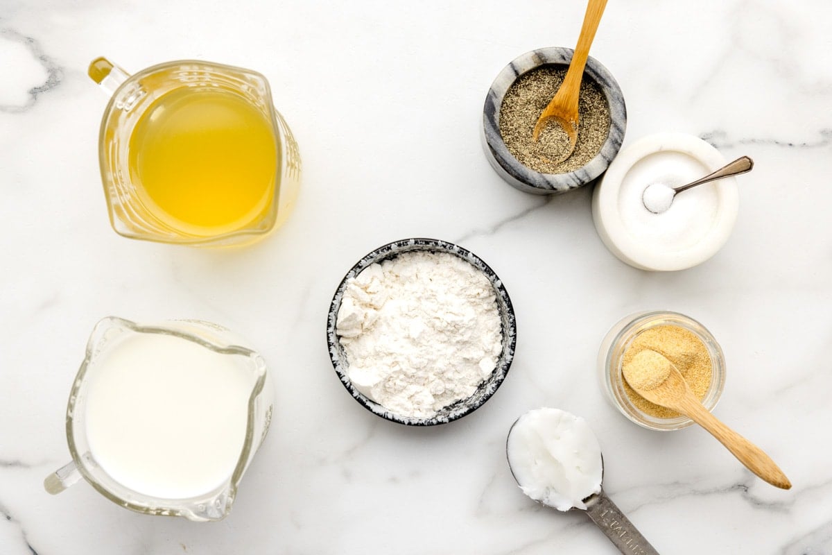 Measured ingredients on a kitchen counter for making gravy.