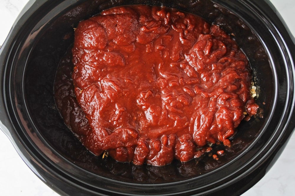 Ingredients for crockpot brisket poured over meat.