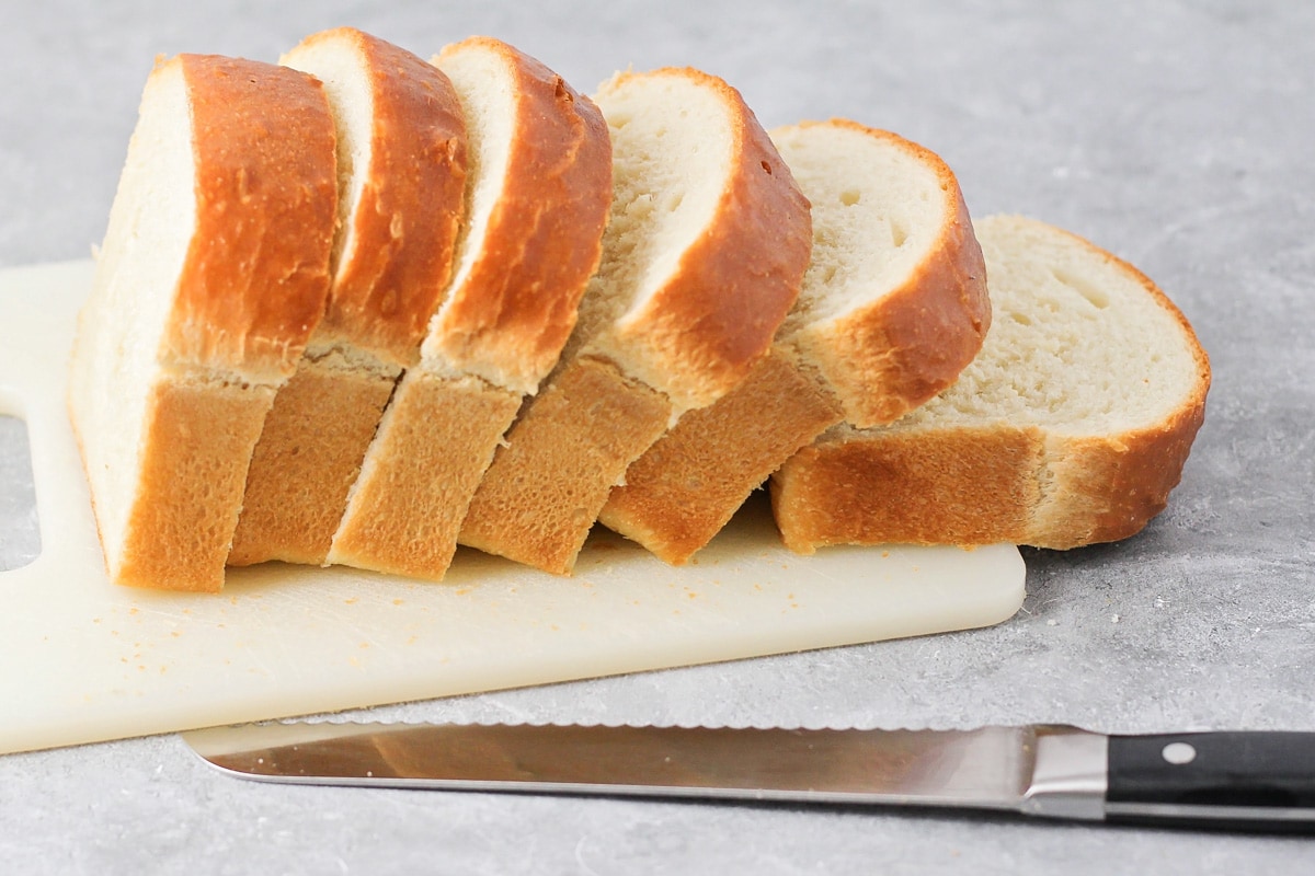 Bread loaf cut into thick slices.