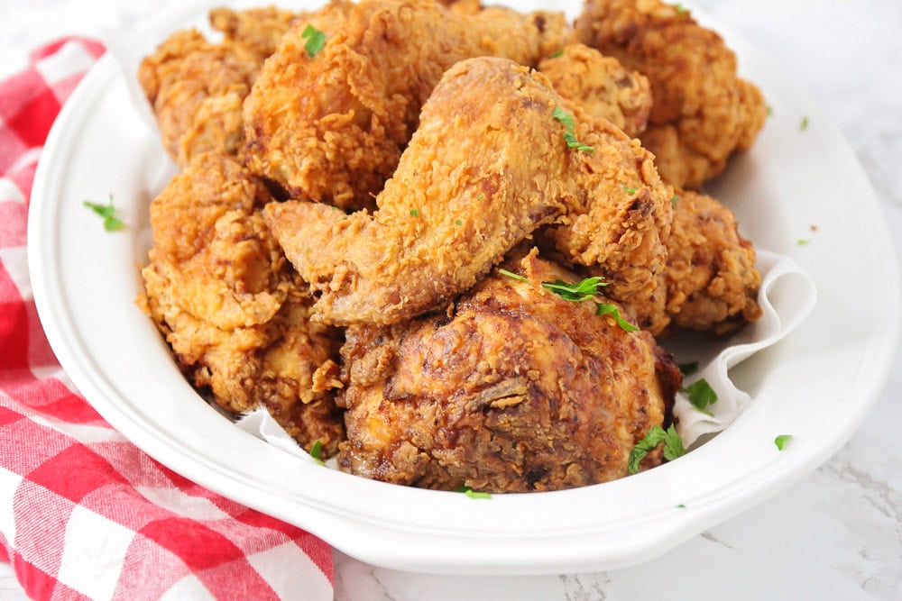 Buttermilk fried chicken recipe served on a white plate.