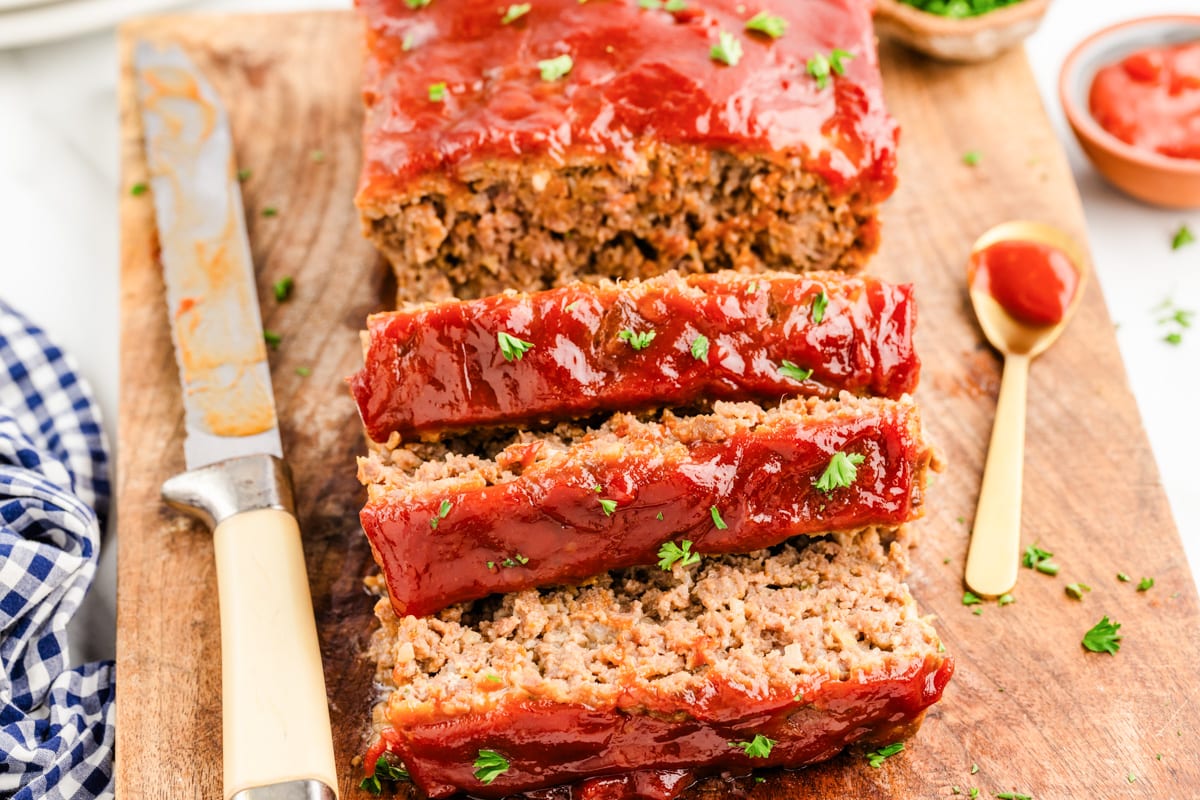 Close up of sliced lipton onion soup meatloaf topped with a ketchup glaze.