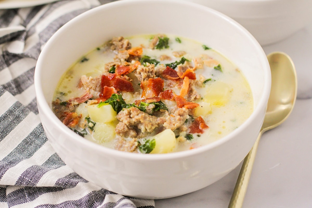 A bowl filled with Olive garden Zuppa toscana soup.