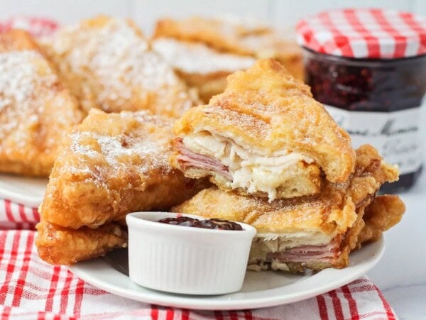 Monte Cristo Sandwich recipe cut and stacked on white plate.