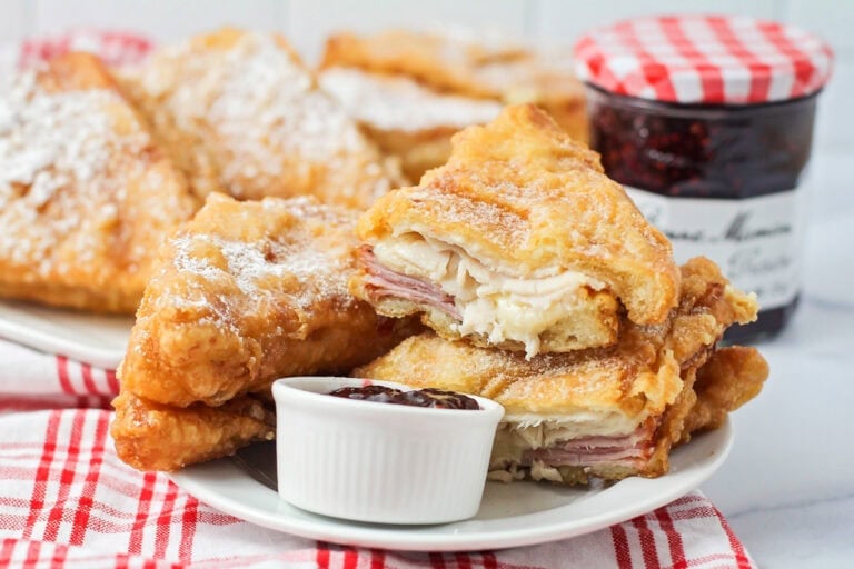 Monte Cristo Sandwich recipe cut and stacked on white plate.