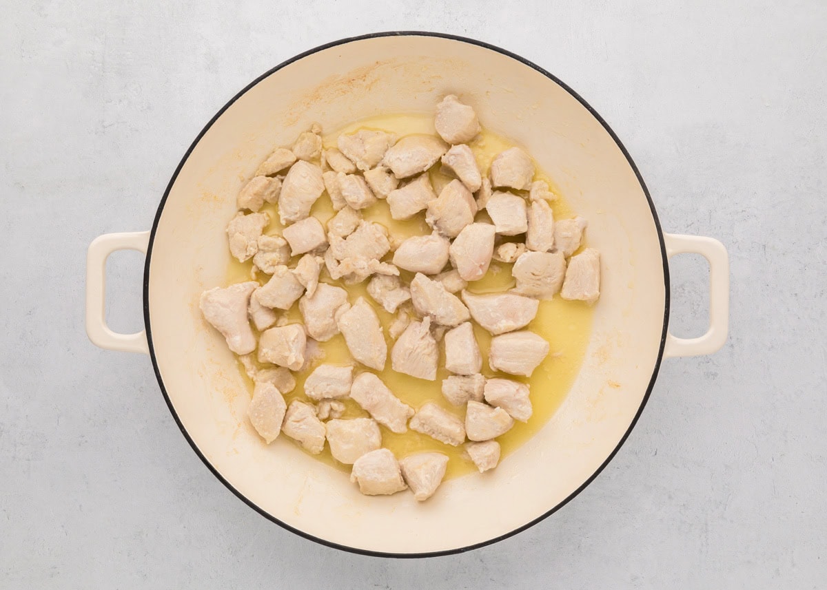 Cooking chicken in a dutch oven.