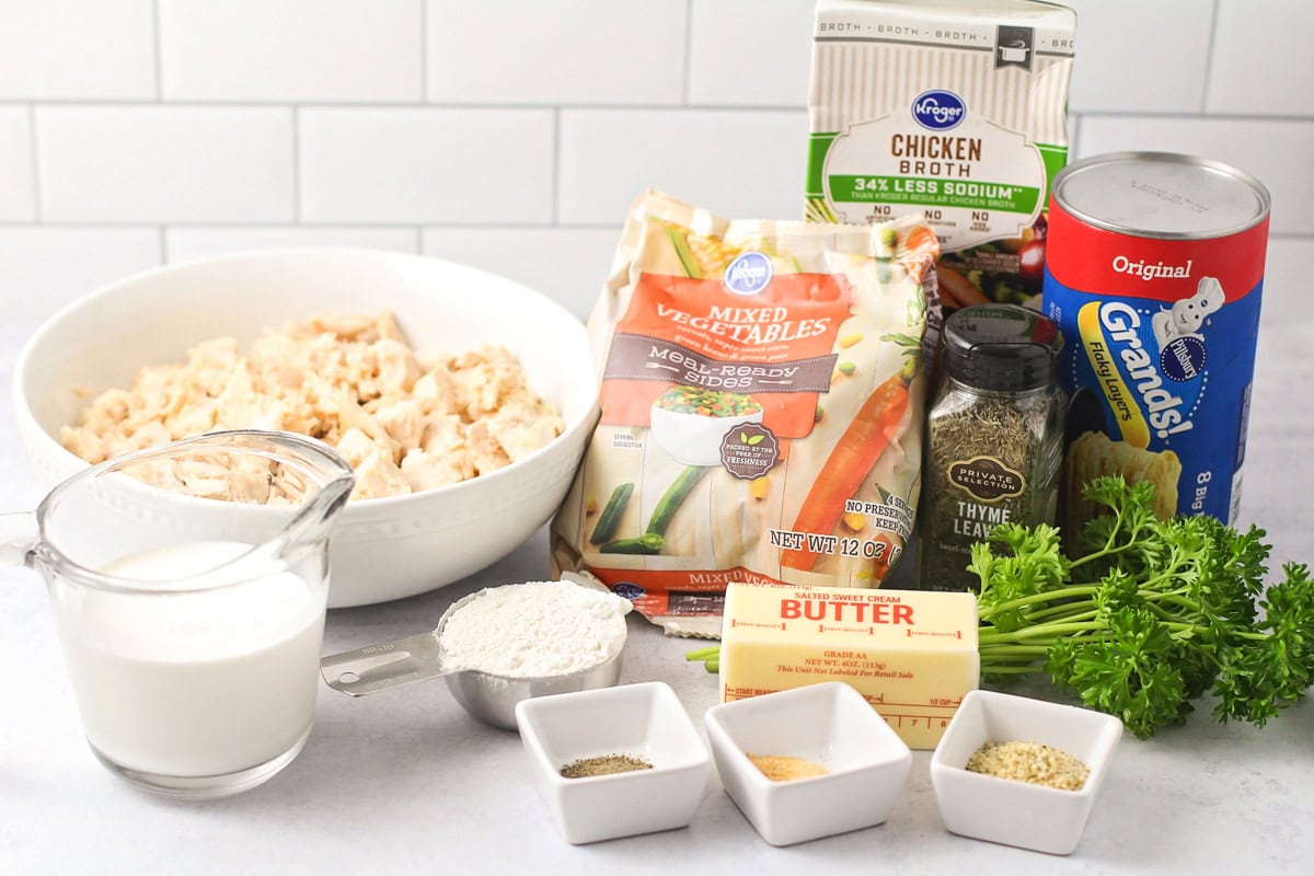 Ingredients for chicken pot pie casserole on a kitchen counter.