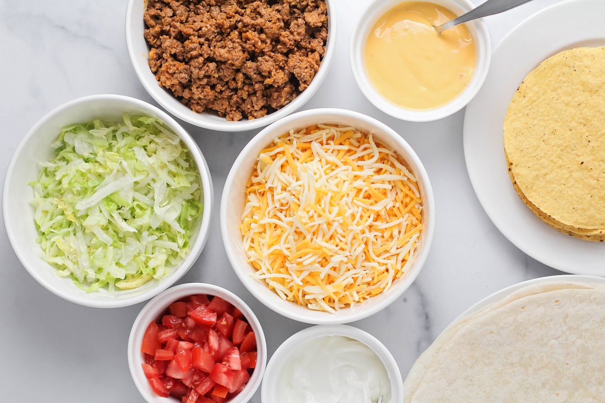 Ingredients for crunchwrap supreme on a kitchen counter.