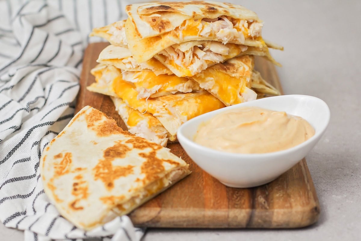 Chicken quesadilla recipe stacked on top of each other.