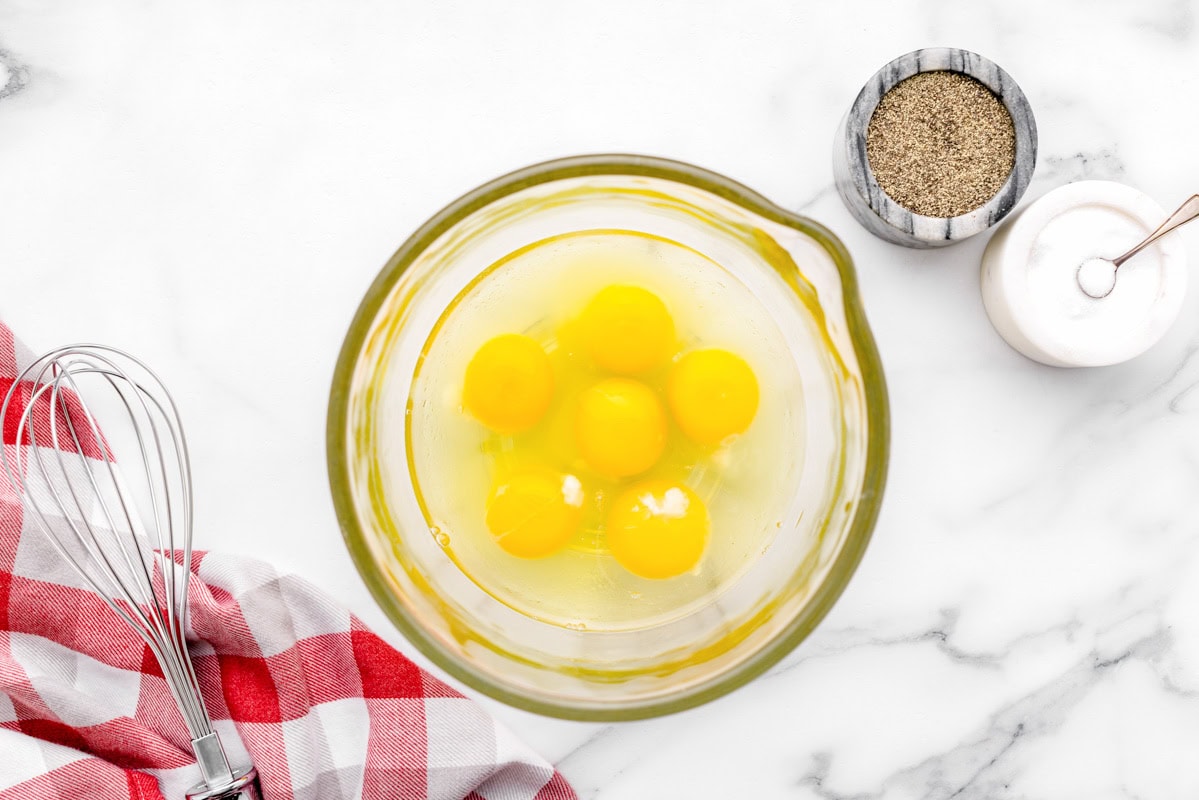 Eggs in glass measuring cup.