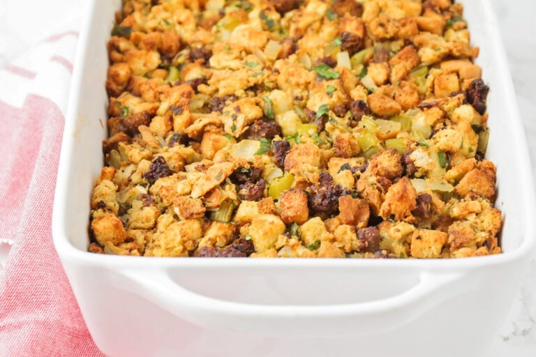 Close up image of sausage stuffing recipe in casserole dish.