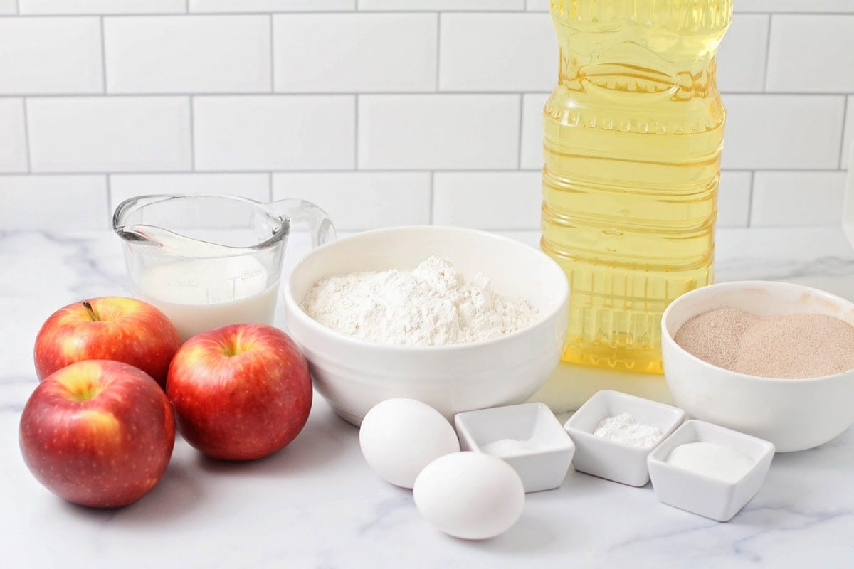 Ingredients for apple fritters on a kitchen counter.