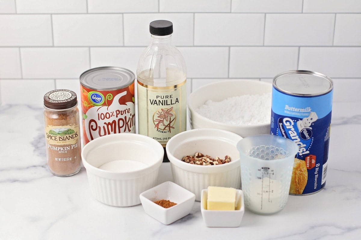 Ingredients for pumpkin fritters on a kitchen counter.