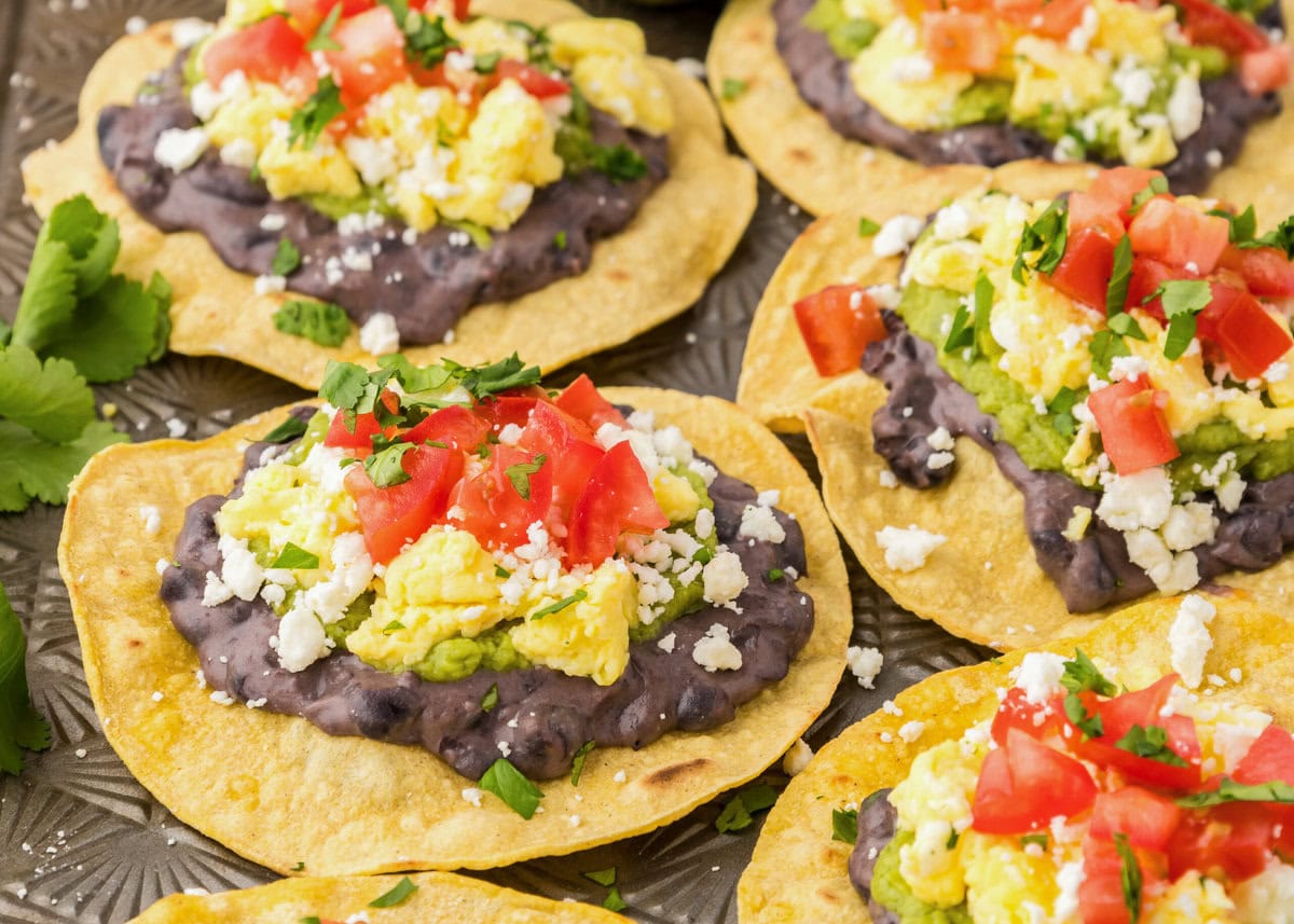 Close up of refried black beans on breakfast tostadas.