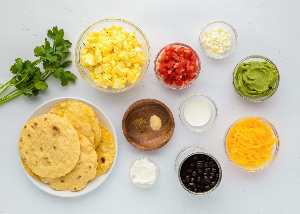 Ingredients for breakfast tostadas on a kitchen counter.