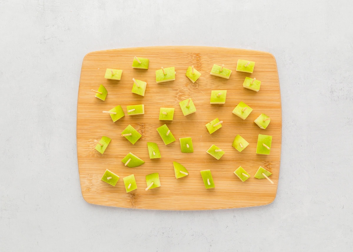 Diced apples stuck with toothpicks.