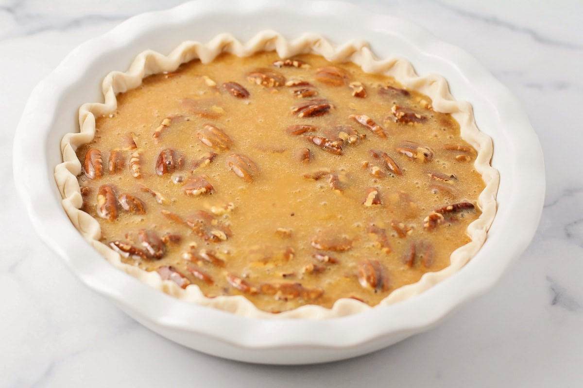 Pecan caramel filling in a pie crust.