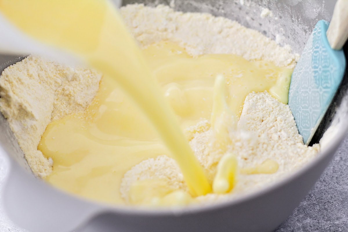 Liquid ingredients being poured into the dry ingredients.