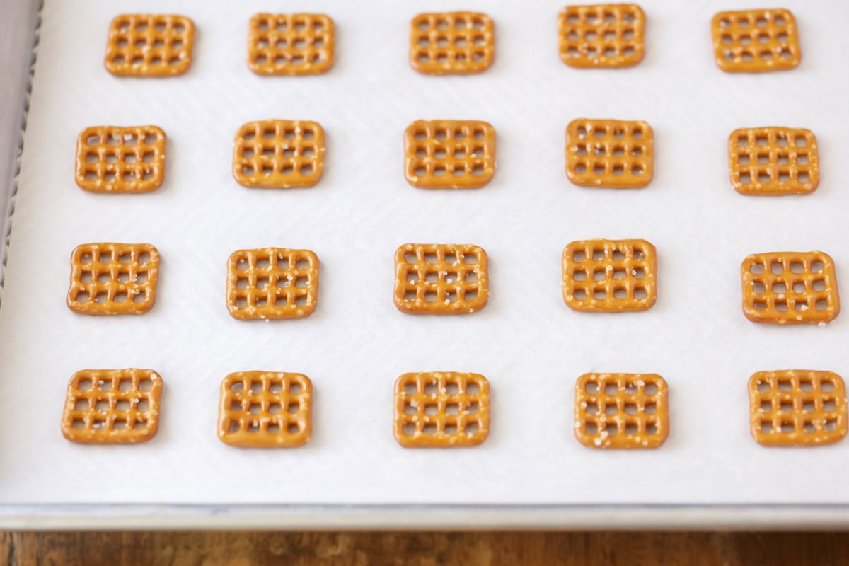 Pretzels on a lined baking sheet.