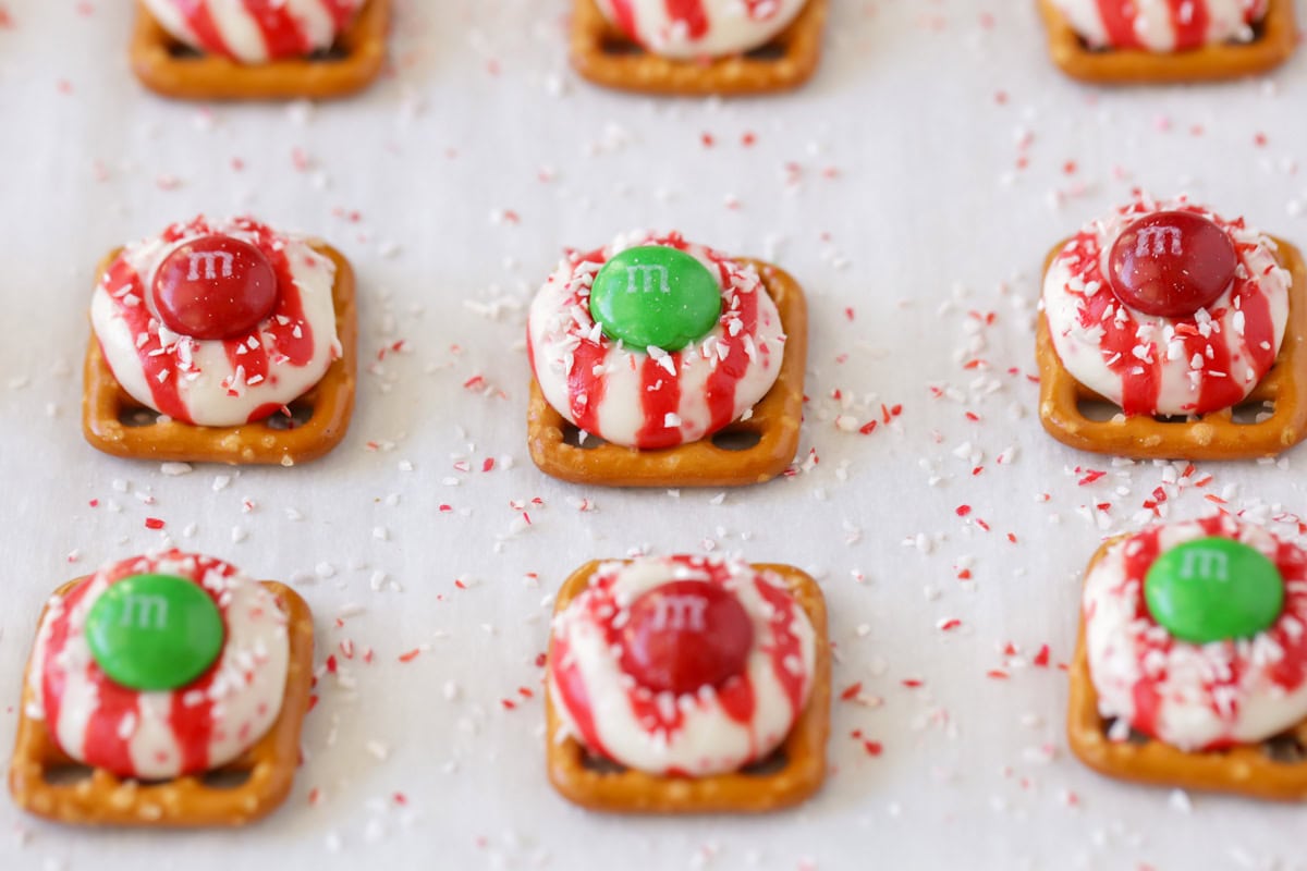 Pretzels topped with melted kisses and M&Ms.