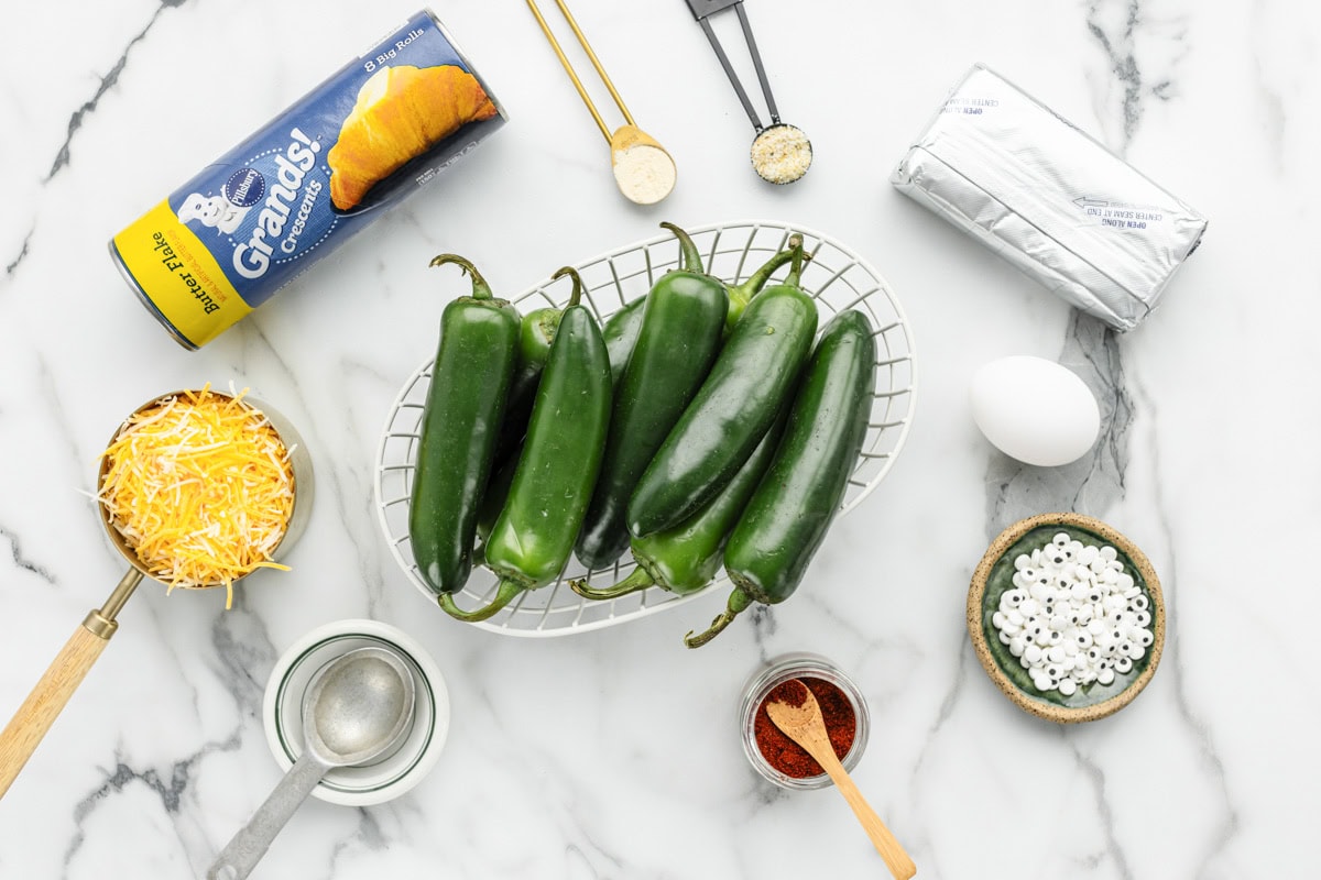 Jalapeno popper ingredients on a kitchen counter.