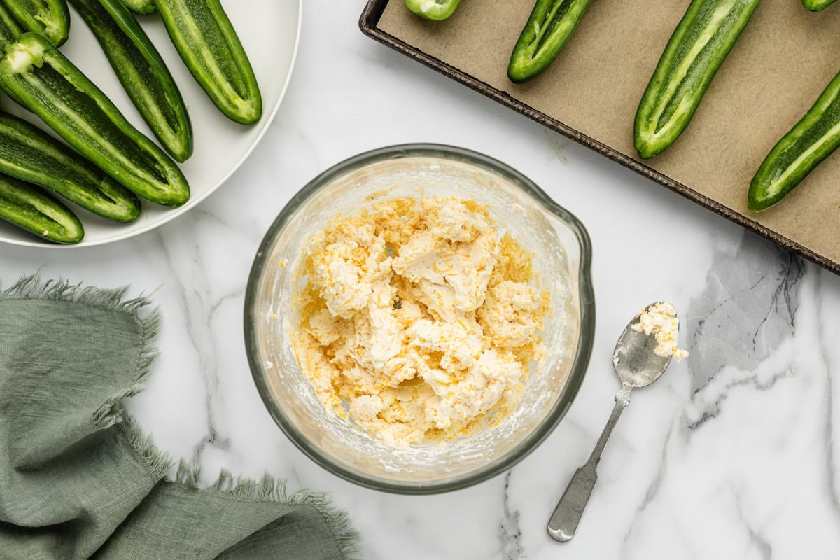 Cream cheese filling for poppers in glass bowl.