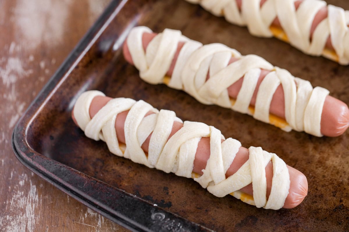 Hot dog and cheese wrapped with crescent rolls.