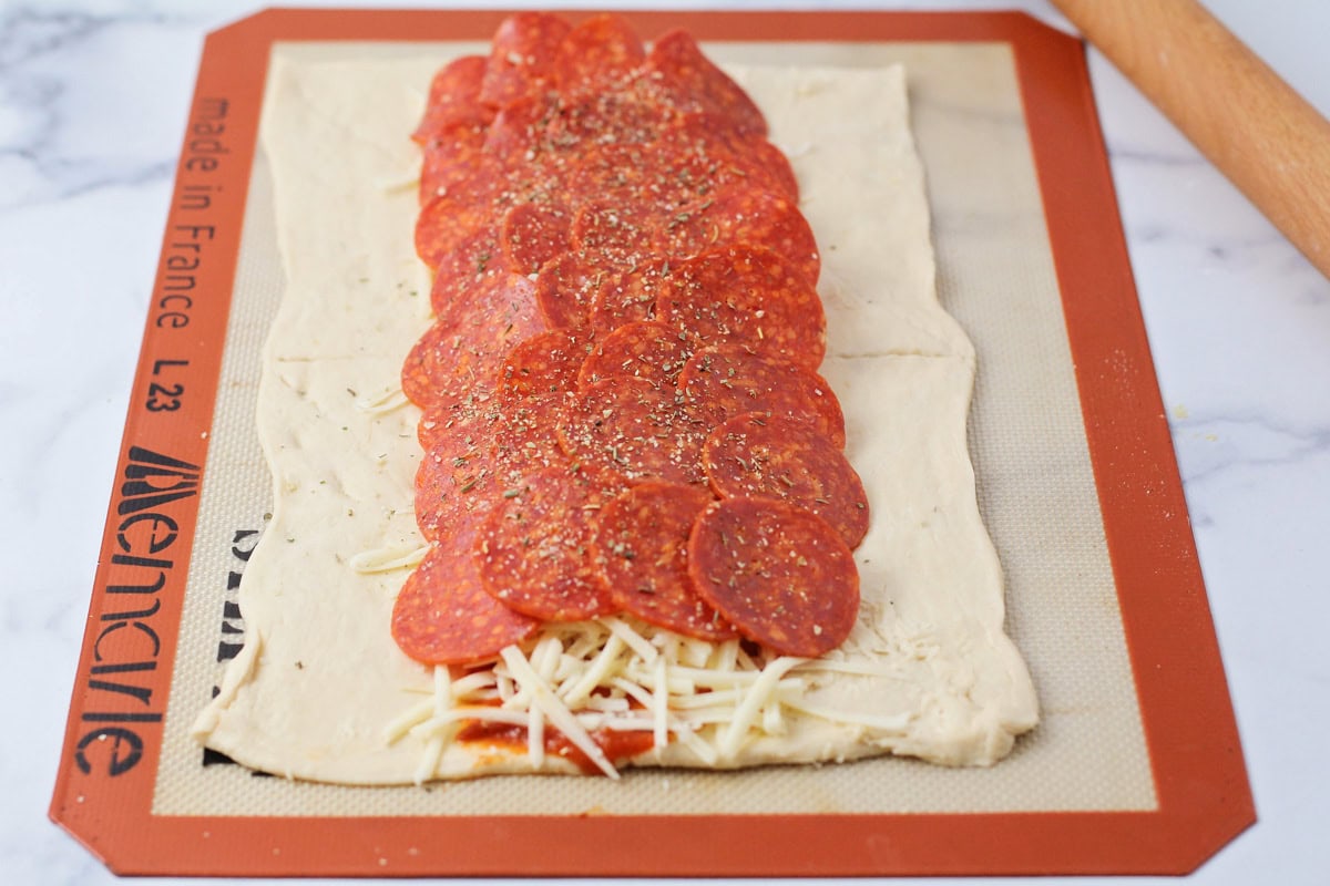 Homemade pizza seasoning sprinkled over pizza.