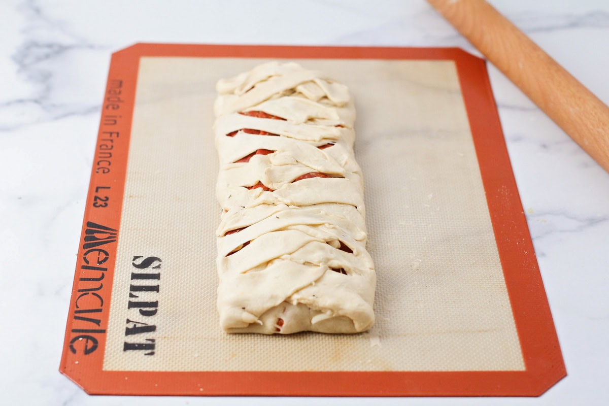 Braided crescent dough to make a mummy shape.