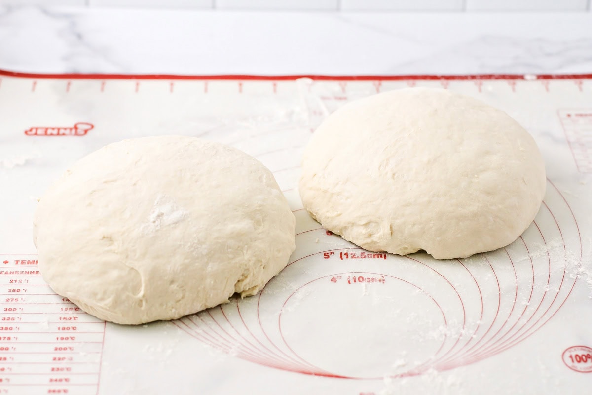 No knead bread dough shaped into round balls.