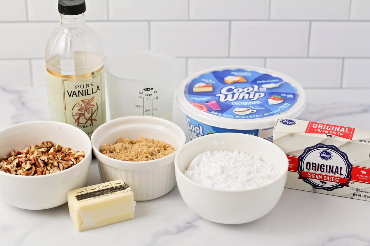 Ingredients for pecan pie dip on a kitchen counter.