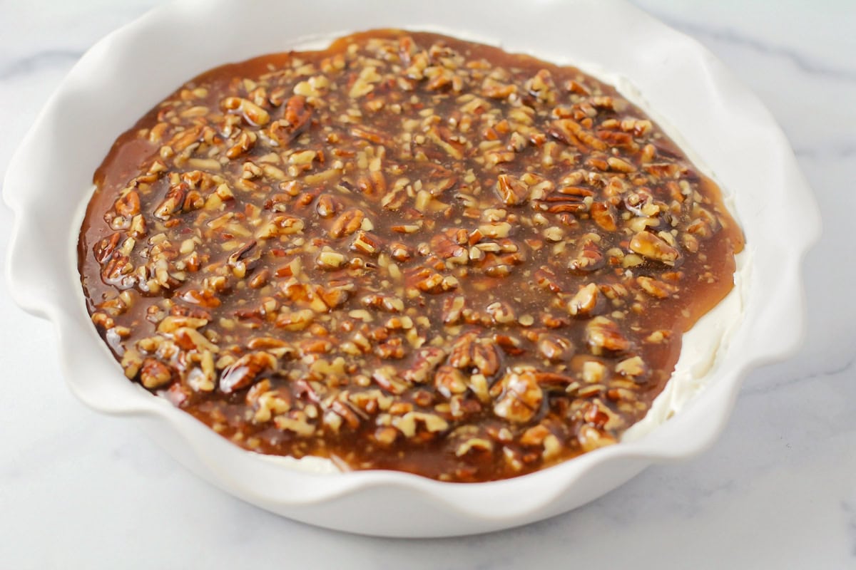 Pecan pie dip served in a white dish.