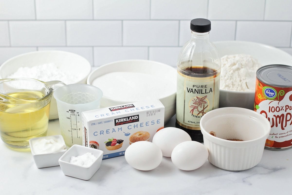 Ingredients for pumpkin bundt cake on a kitchen counter.