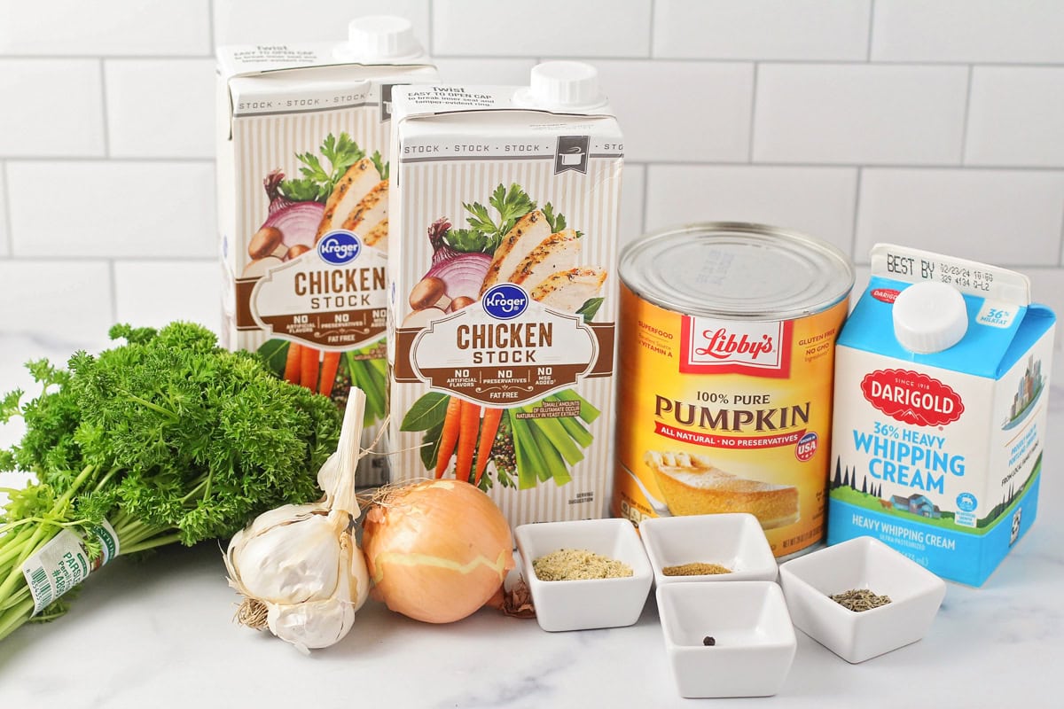 Pumpkin soup ingredients on a kitchen counter.