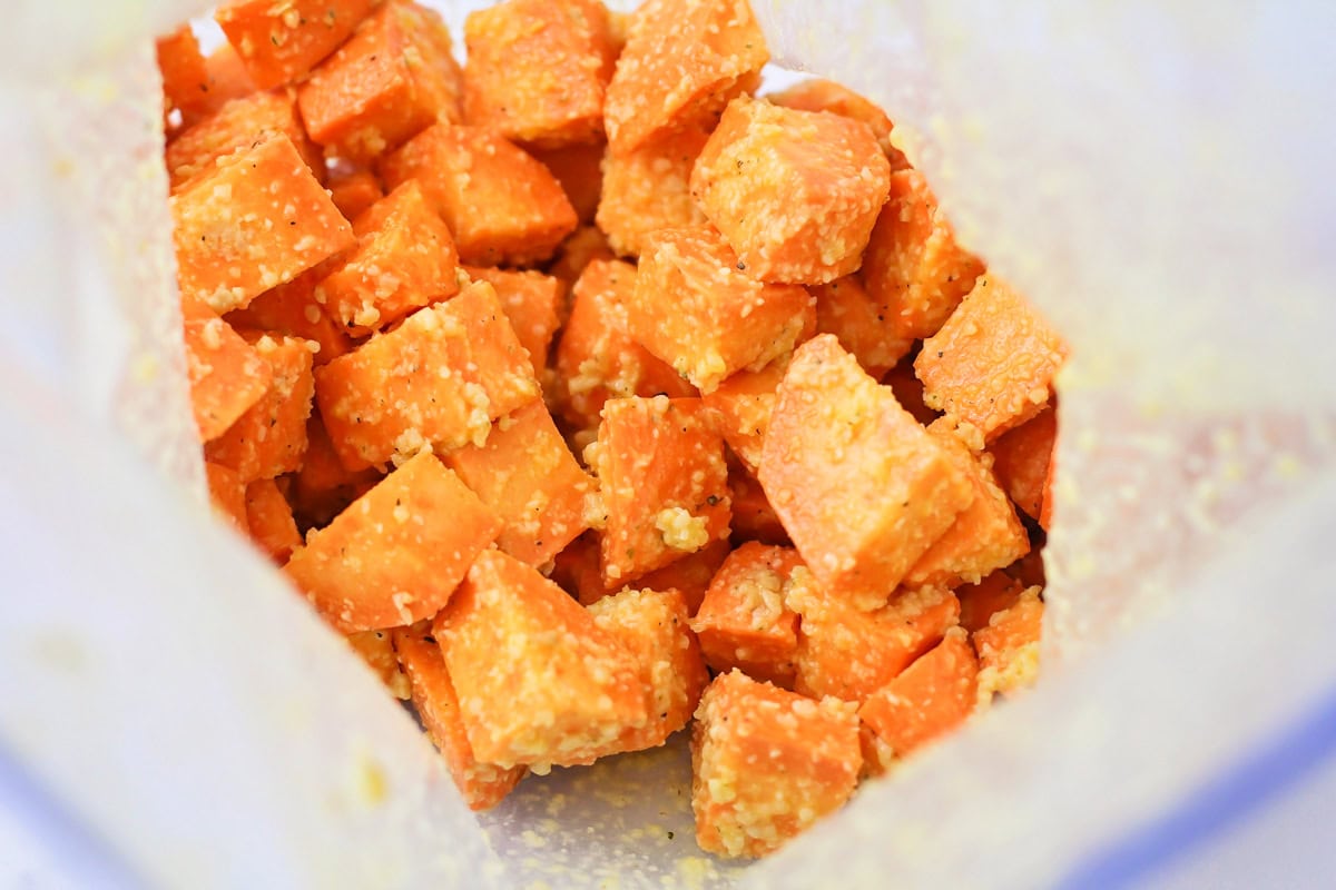 Sweet potato cubes in Ziploc bag with oil and spices.