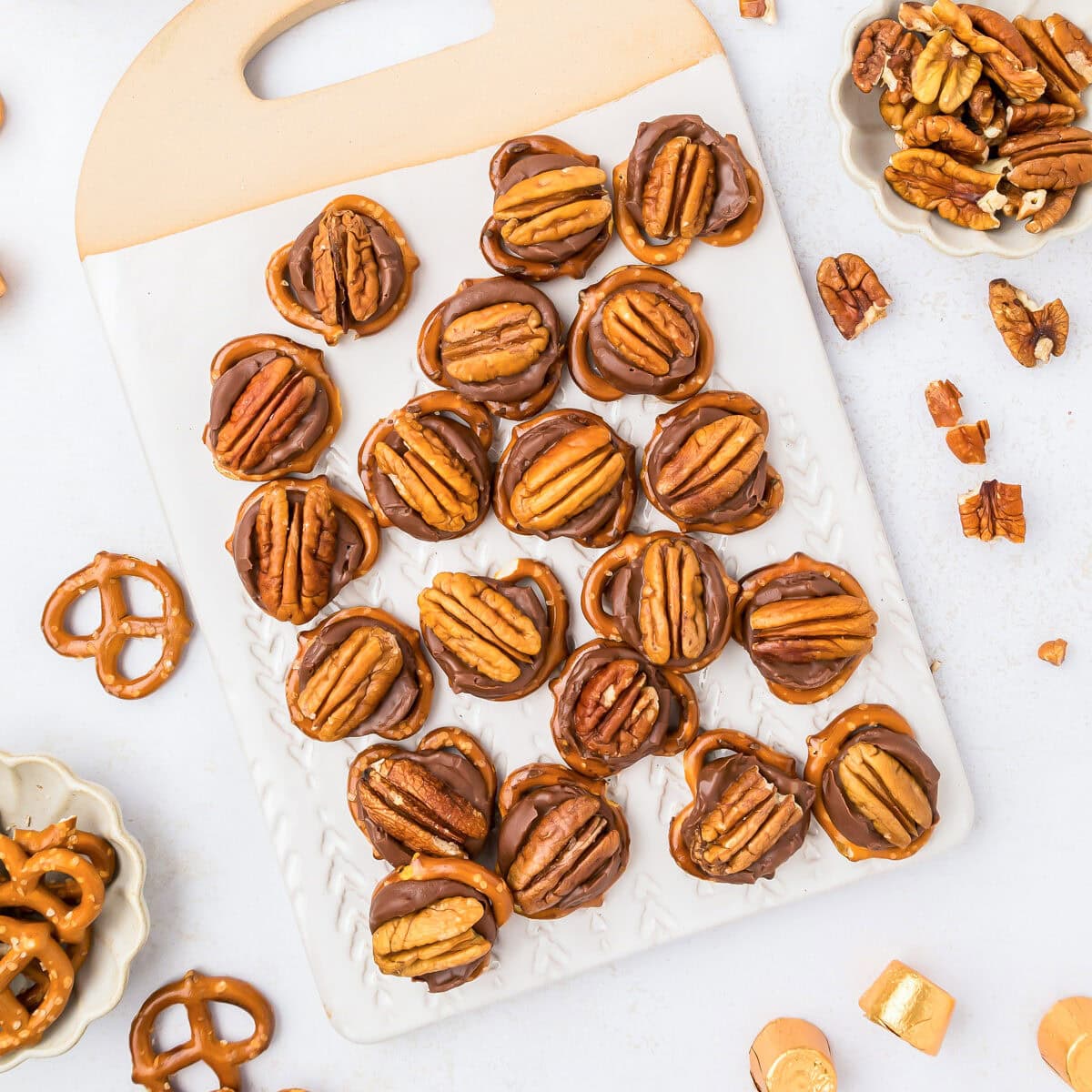 Rolo pretzel turtles on a serving board.