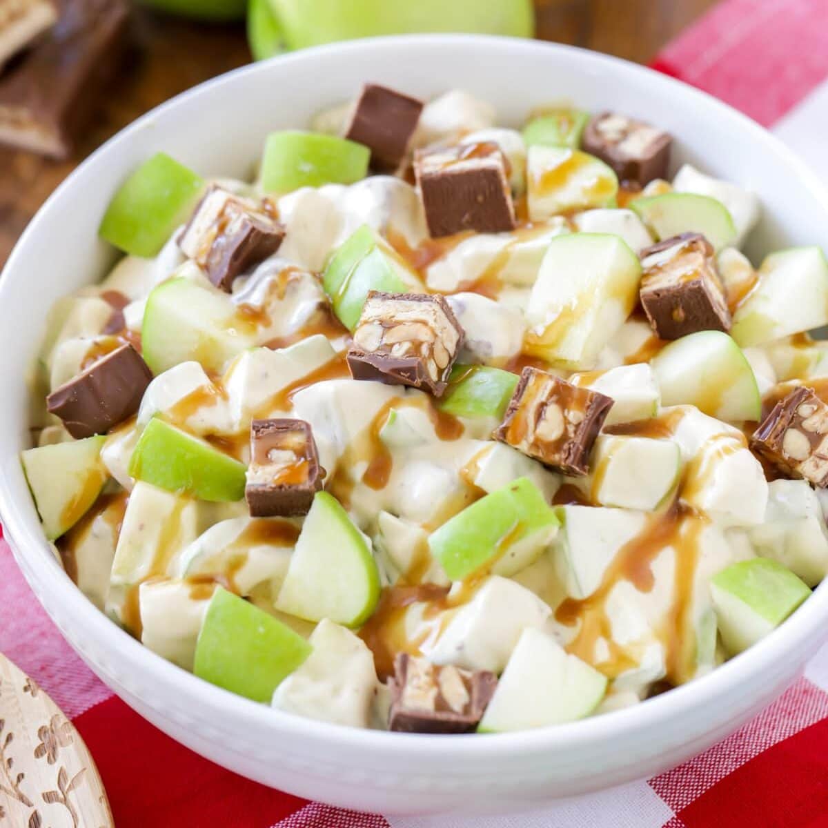 Snickers Salad close up image in white bowl.