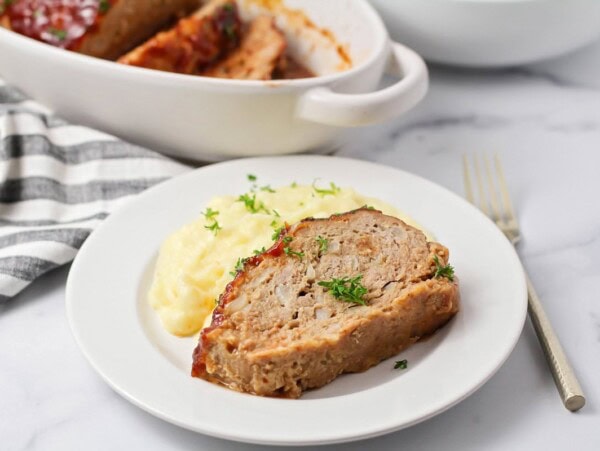 Easy turkey meatloaf served with a side of mashed potatoes.
