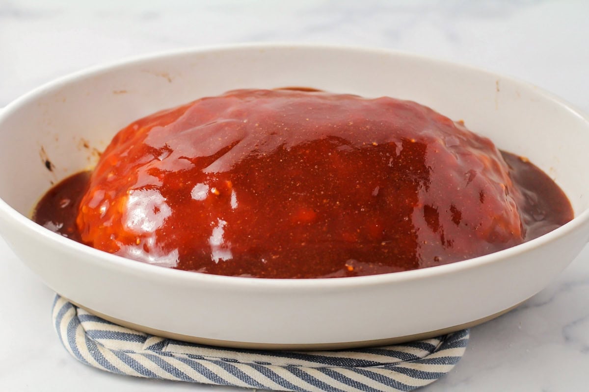 A meatloaf topped with a ketchup mixture.