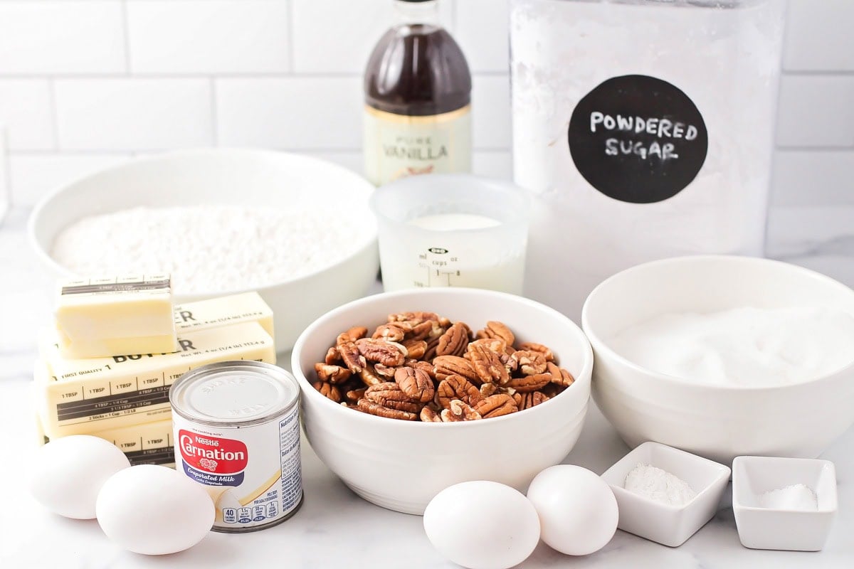 Ingredients for butter pecan cake on a kitchen counter.