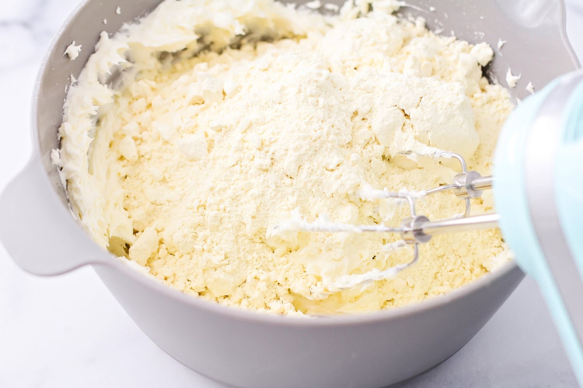 Mixing cookie batter in a gray bowl.