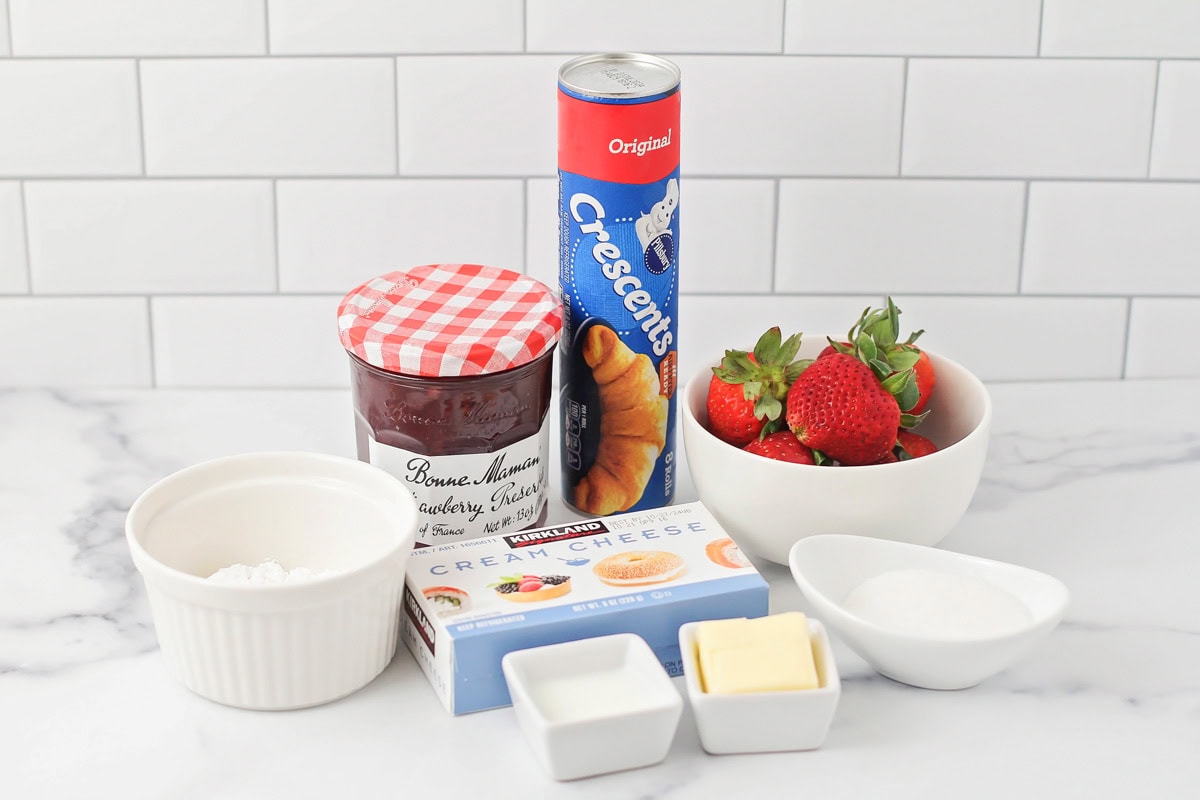 Strawberry danish ingredients on a kitchen counter.